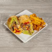 Grilled Churrasco Steak Wrap · Grilled onions & peppers, corn, avocado, jack cheese & tomatillo salsa - in a sundried tomat...