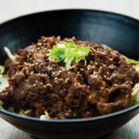 Umakara Beef Bowl · Thin-sliced Yakishabu beef marinated in our sweet & spicy Umakara sauce with sliced onions o...