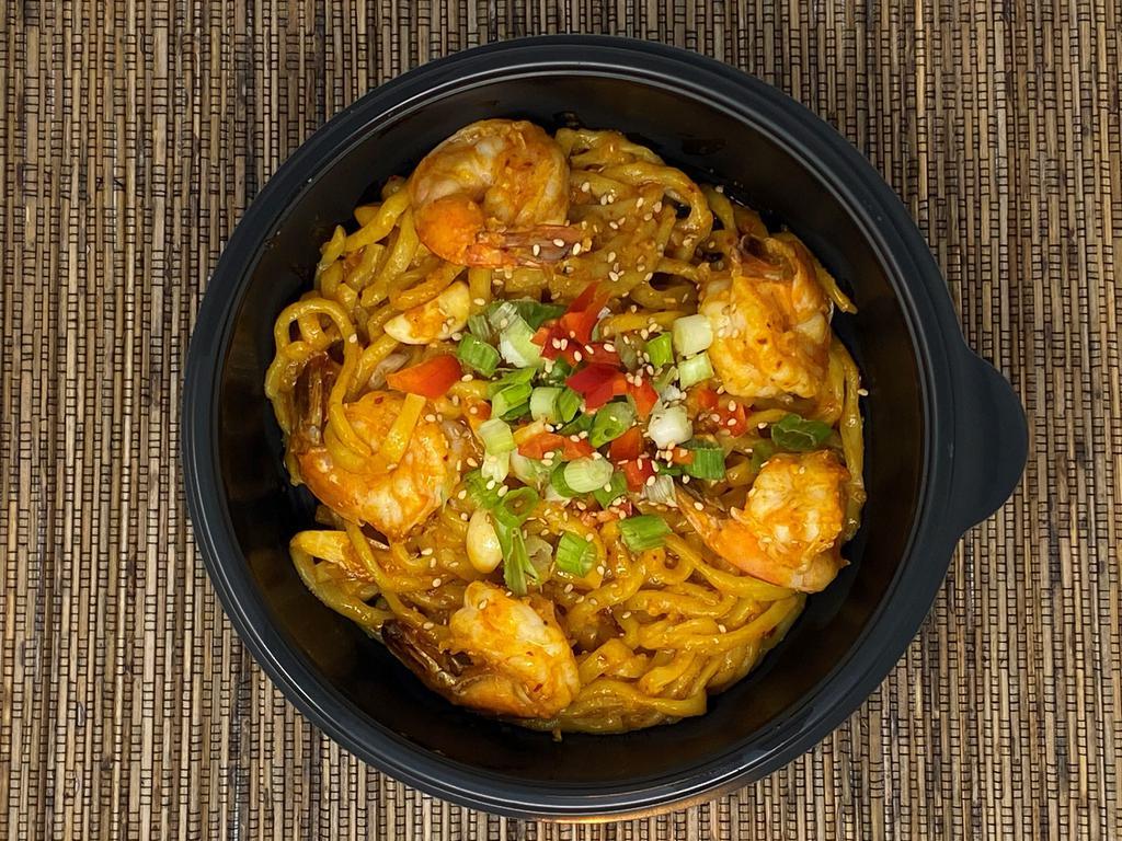 Garlic Noodles with Crunchy Garlic Shrimp · Crunchy Garlic Shrimp atop thick Japanese noodles stir-fried with sliced garlic, crunchy chili garlic oil, butter, and soy sauce. Topped with diced red bell peppers, chopped green onions, and sesame seeds. Mildly spicy.