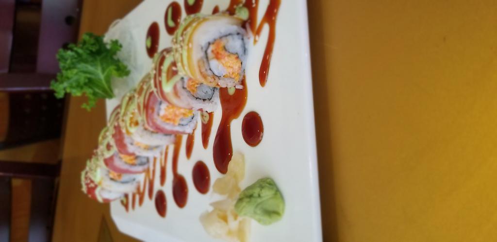 Candy Cane Roll · Sushi shrimp, crab salad and crunchy inside, tuna and white tuna on top with special sauce.