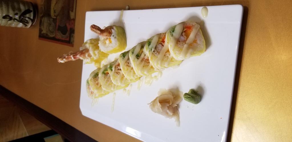 SR16. Mango Passion Roll · Sweet mango, shrimp tempura and avocados roller in soy wrap topped with house mango sales.