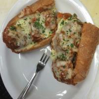 Meatball Parmigiana Samwich · Aunt Millie’s homemade meatballs on long roll with fresh mozzarella and basil.