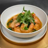 Curry Shrimp · Yellow curry jumbo shrimp served jasmine rice and sautéed spinach.