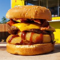Western Bacon Burger  · Cheese, BBQ sauce and 2 onions rings.