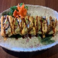Chuck Norris Roll · Shrimp tempura, eel, spicy tuna and avocado roll, then deep-fried and
topped with spicy mayo...