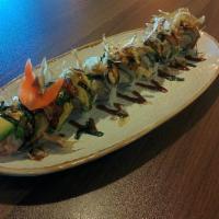 Dragon Roll · Shrimp tempura, imitation crab, cucumber and avocado roll topped
with eel, bonito flakes, ma...