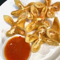 Crab Cheese Wontons · 6 Crab, cream cheese, scallion filled fried wontons. Served with sweet chili sauce