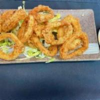 Crispy Calamari · Battered and flash fried served with lime wedge and sweet chili sauce.