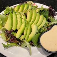 Avocado Salad · Mixed greens topped with thinly sliced avocado and sesame seed. Served with house dressing o...