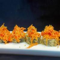 Volcano  · Spicy tuna, avocado, and cream cheese in a deep fried roll, topped with spicy crab meat, tob...