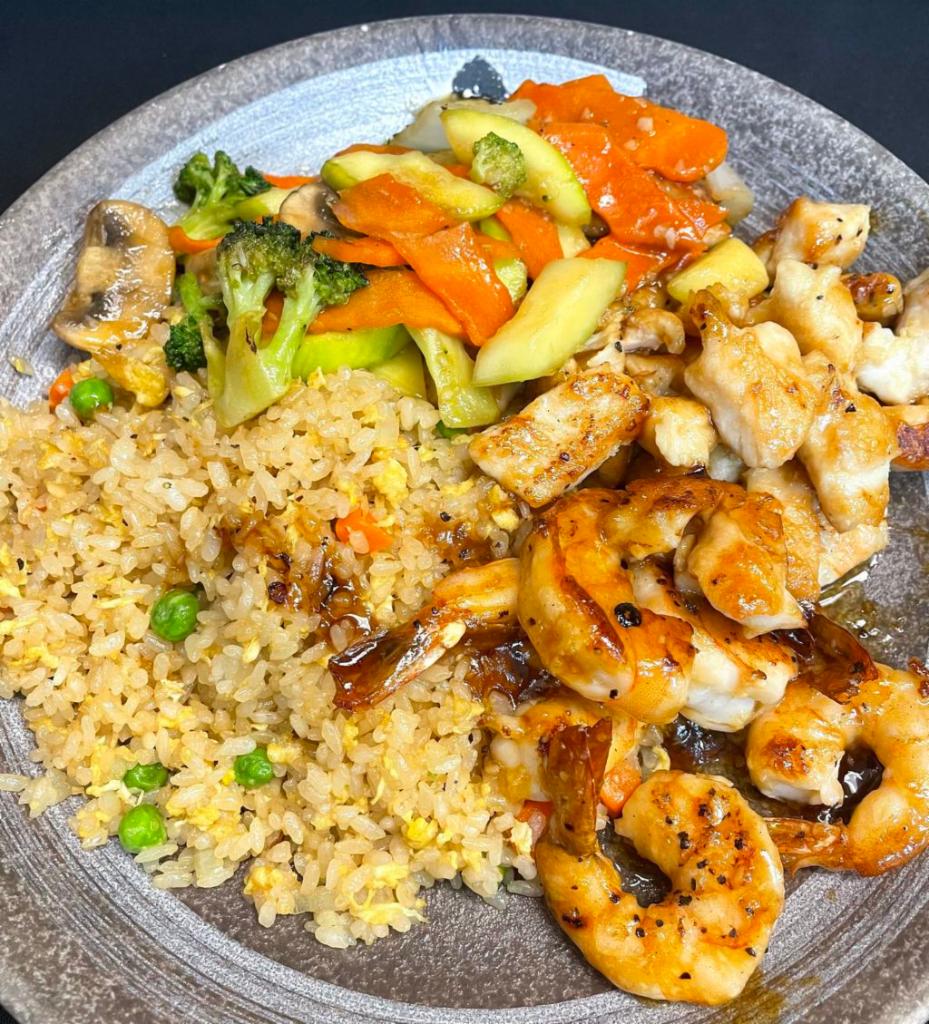 Hibachi Chicken and Shrimp · Hibachi Style Chicken and Shrimp with wok sauteed vegetables and fried rice.  Served with mushroom soup and house salad.  Yum Yum sauce and Ginger Sauce on the side. 