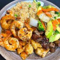 Hibachi Chicken, Shrimp, Steak · Hibachi Style Chicken, Shrimp, and Steak with wok sauteed vegetables and fried rice.  Served...