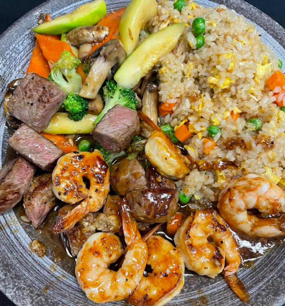 Hibachi Filet Mignon and Shrimp · Hibachi Style Filet Mignon and Shrimp with wok sauteed vegetables and fried rice.  Served with mushroom soup and house salad.  Yum Yum sauce and Ginger Sauce on the side. 