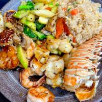 Hibachi Seafood Combination · Hibachi Style Lobster Tail, Shrimp, and Scallops with wok sauteed vegetables and fried rice....