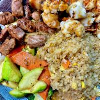 Hibachi Filet Mignon and Lobster Tail · Hibachi Style Filet Mignon and Lobster Tail with wok sauteed vegetables and fried rice.  Ser...