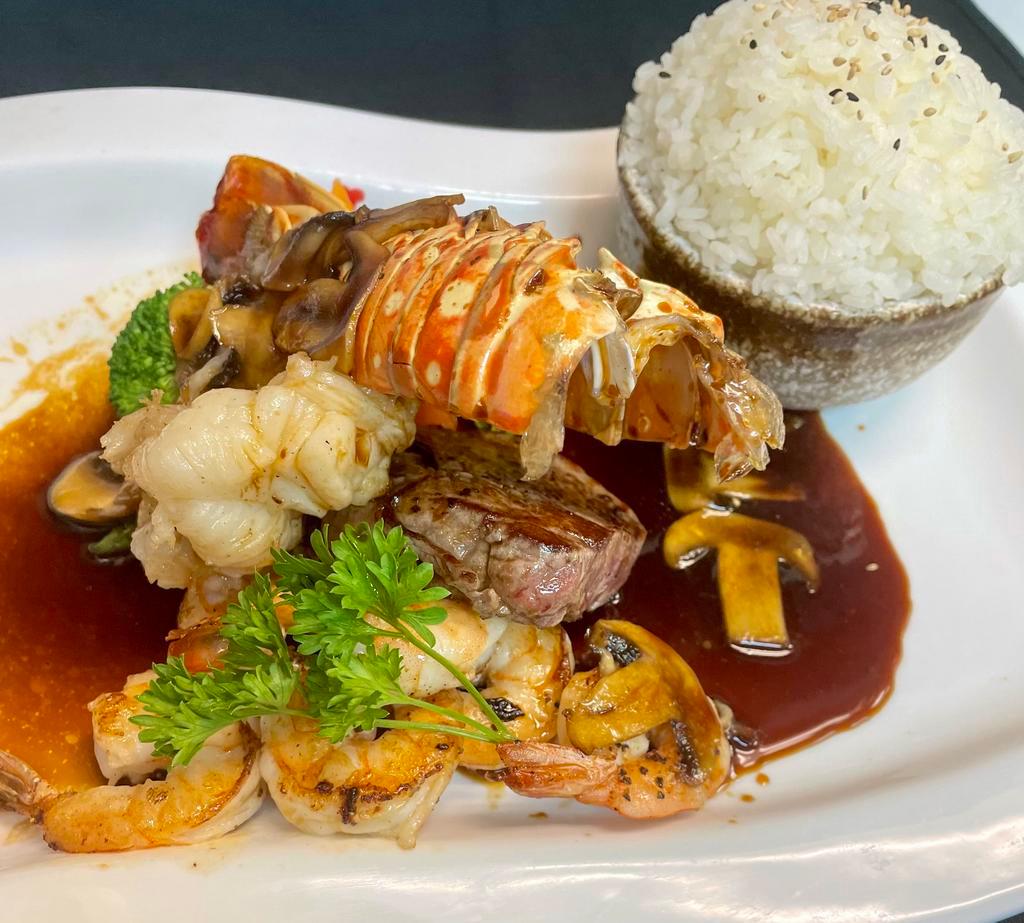 Surf and Turf · Grilled filet mignon, lobster tail, and shrimp, served with mushroom truffle sauce.  Served with choice of rice, miso soup and house salad.