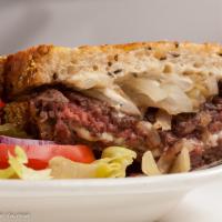 Mels Patty Melt · A juicy 1/3 lb grass fed-beef hamburger patty, melted Swiss, grilled onions and 1000 island ...