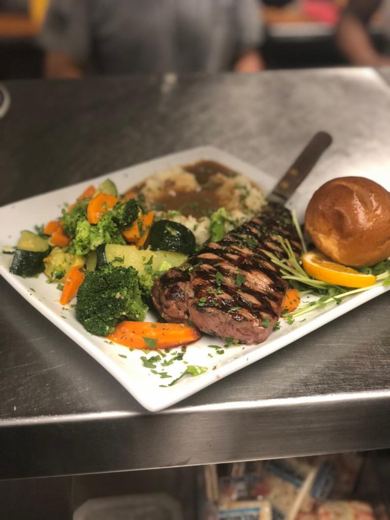10 oz. New York Steak Dinner · Served with green salad, mashed potatoes, fresh vegetables and roll. Gluten-free possible.
