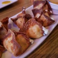 Crab Rangoon · Deep fried wonton stuffed with crab meat, combined with celery, cream cheese and served with...