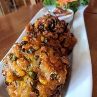 Corn Cakes · Deep fried kernels corn combined green beans and lime leaves, served with sweet and sour sau...
