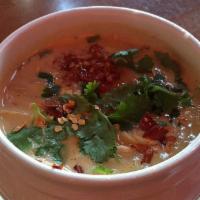 Tom Kha with Chicken Soup · Coconut milk soup with chicken, mushroom, onions and galangal topped with onion and cilantro.