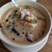 Tom Kha with Prawns Soup · Coconut milk soup with prawns, mushroom, onions and galangal topped with onion and cilantro.