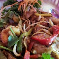Pad Southern Noodle · Stir-fried flat noodles mixed in yellow curry powder, with choice of protein, yellow onion, ...