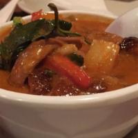 Duck Curry · Roasted duck, pineapple, tomatoes, basil and bell pepper in red curry sauce.