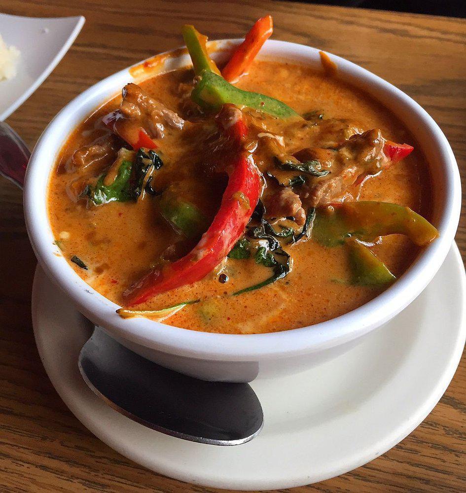 Panang Curry Seafood · Seafood with zucchini, basil and bell pepper in panang curry sauce.