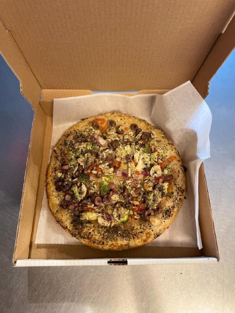 Vegan Pizza Special  · Garlic based white pizza with olive oil,  garlic crust, black olives, green peppers, artichoke hearts, mushrooms, roasted peppers, spinach and fresh garlic. 