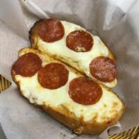 Pepperoni Cheese Bread · Three slices of our freshly homemade garlic bread topped with melted mozzarella cheese & pep...