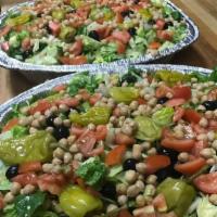 Small House Salad · Romaine & iceberg lettuce, black olives, garbanzo beans & pepperoncini. Served with choice o...