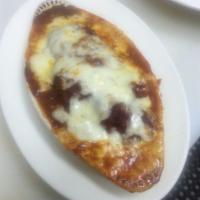 Eggplant Parmigiana · Breaded eggplant layered & baked with Parmesan cheese & mozzarella cheese with homemade mari...