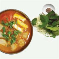 44. Bun Rieu · Rice noodle with seafood balls, pork, tofu in tomato soup.