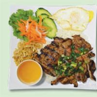 32a. Com Dac Biet Thit Nuong · Grilled pork, shredded pork and fried egg with steamed rice.
