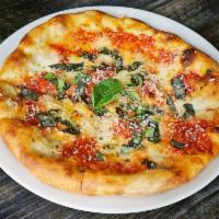 Margherita Pizza · Mozzarella, basil and extra virgin olive oil.