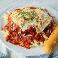 Classic Chicken Parmesan · Hand-breaded garlic parmesan chicken topped with melted mozzarella & hearty marinara over pe...