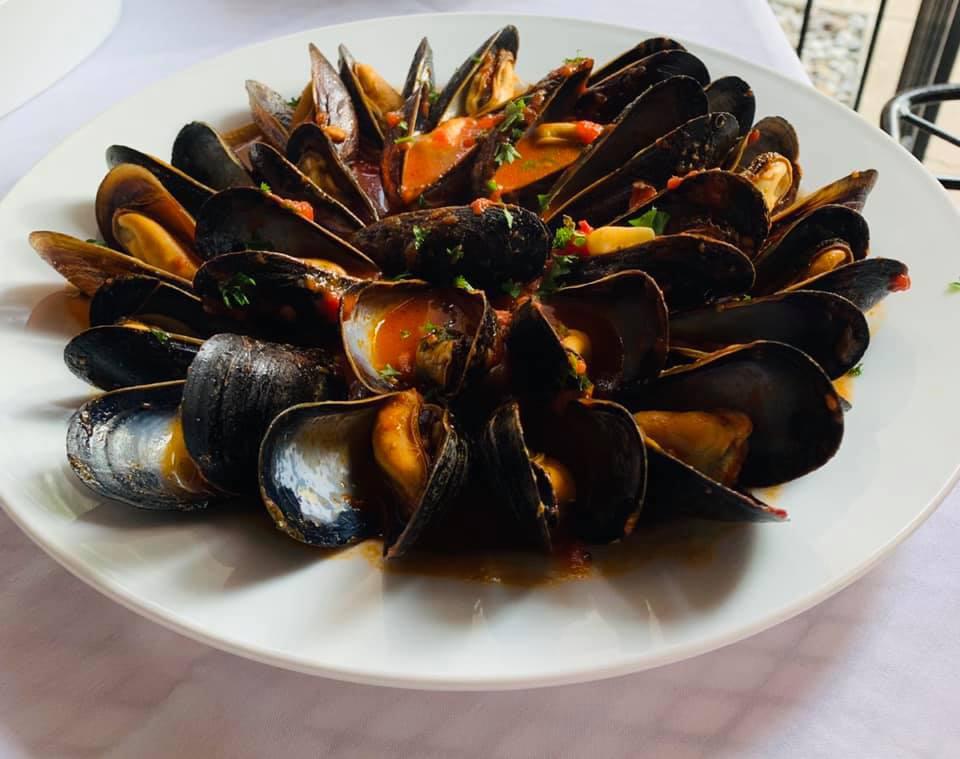 Cozze Rosso · Sauteed mussels in a marinara wine sauce.