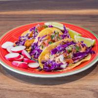 Tres Tacos Estilo Ensenada · Choice of crispy fish or breaded shrimp- on a corn tortilla, topped with cabbage, chipotle s...
