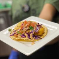Crispy Fish Taco · Crispy Soy Fish on a corn tortilla, topped with cabbage, chipotle sauce, & pico de gallo.