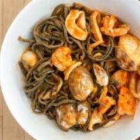 Bigoli Al Sapori Del Golfo · Homemade black spaghetti with clams, shrimp, scallops, calamari in a garlic, and marinara sa...