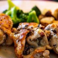 Petto D'Pollo Alle Olives e Vino Bianco · Sautéed rolled chicken breast with black olives, mozzarella cheese, and topped with white wi...