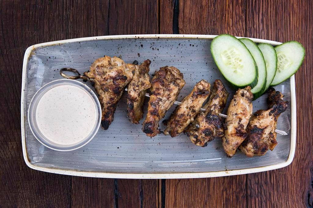 Smoked and Grilled Chicken Wings · 1 lb. HABF, hickory and applewood smoked, Alabama white sauce and cucumber. Gluten free.