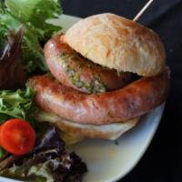 Linguica sandwich · Brazilian pork sausage grilled, classic green mix, and provolone cheese, touched up with chi...