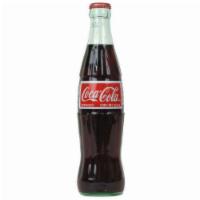 Coca Cola · Glass bottle.