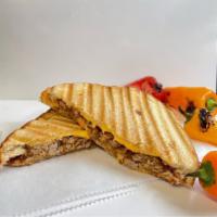 Smoked and BBQ'ed Grilled Cheese · We take three different types of cheese and add either pulled BBQ pork or chicken and grill ...