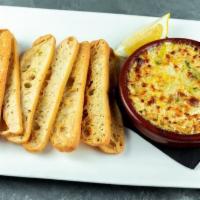 Artichoke Dip · Vegetarian. Oven-baked cheese, roasted red pepper, fresh jalapeño, crostini.