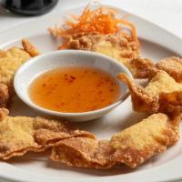 Fried Wonton Appetizer · Golden Phuket style wonton filled with minced shrimp and chicken. Duet of sweet and sour.