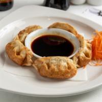 Thai Pot Stickers Appetizer · Choose between fried or steamed dumplings filled with vegetables, chicken, and shrimp with T...