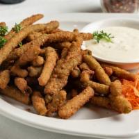 Fried Green Beans Appetizer · Fried green beans with ranch sauce on the side.